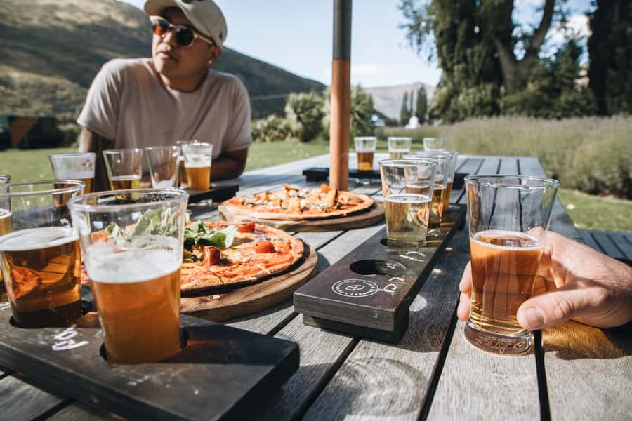 Queenstown: Craft Beer Brewery Tour with Lunch - Pickup, Van Time, and a Traditional Village Stop for Stretch Breaks