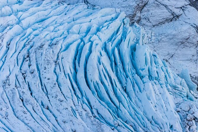Queenstown Helicopter Tour: Glacier Landing and Scenic Views - Tyndall Glacier: Blue Ice, Crevasses, and the Serac View