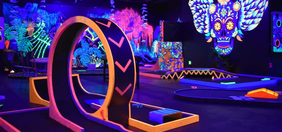 Queenstown: Indoor Putt 'n' Glow Mini Golf - The UV course and Queenstown art: why it feels different