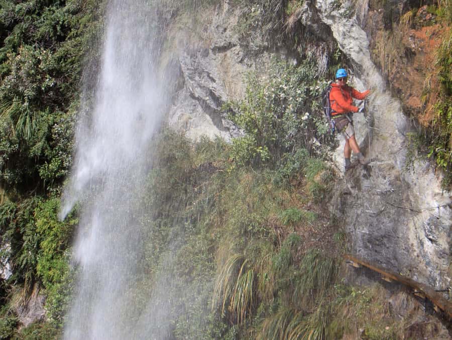 Wanaka: 6-hour Advanced Waterfall Cable Climb - The view breaks: farmland, mountains, and lakes from the route